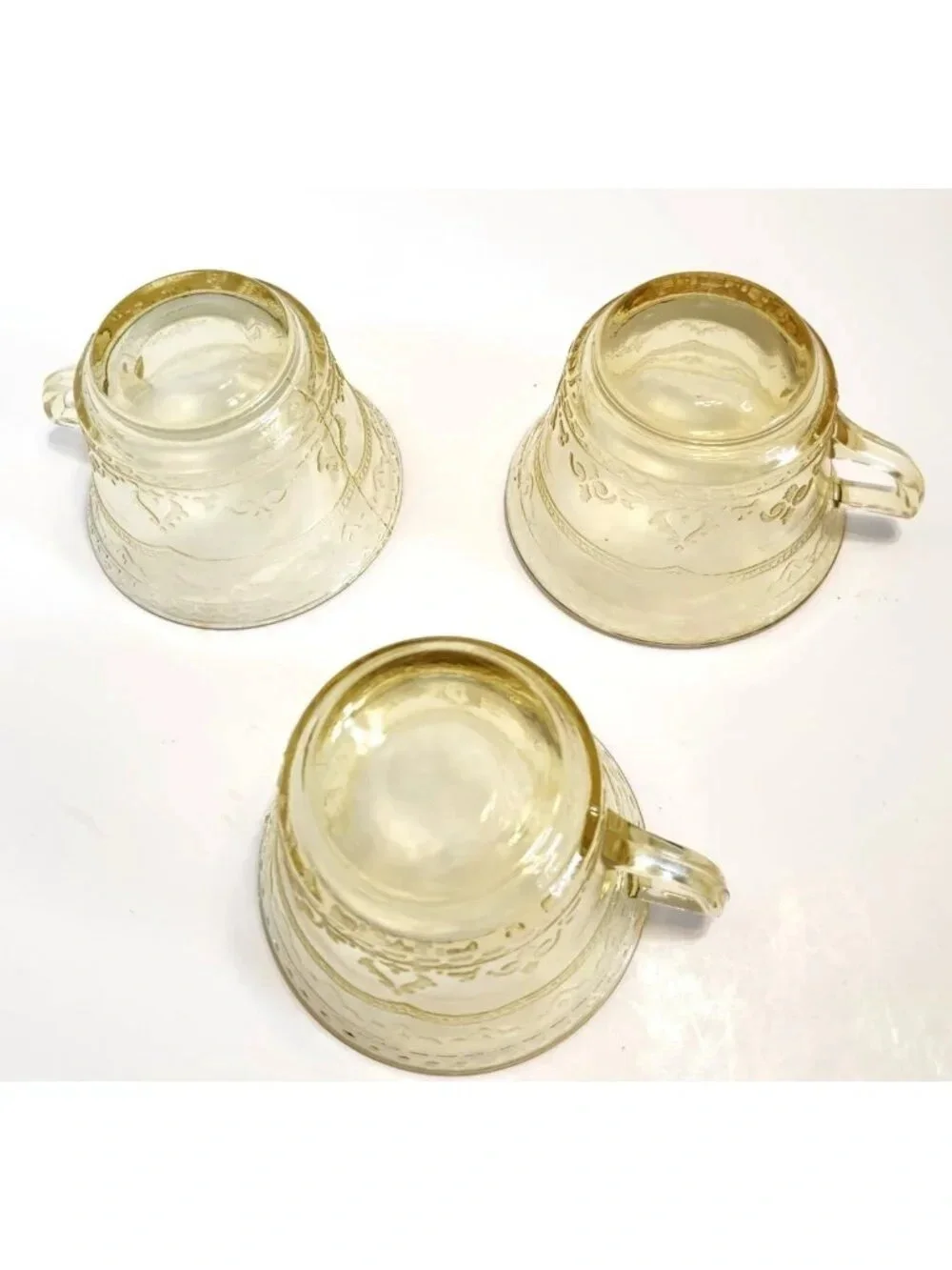 Elegant Amber Glass Teacup with Etched Decorative Pattern